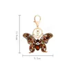 Crystal Butterfly Keychain Glitter Ringue de metal para mulheres Moda Moda Chic Saco de mochila pingente de mochila Acessórios