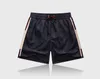 Calças de trilha de tecido à prova d'água estilo designer 2022 calças de praia de verão shorts de surf masculinos shorts de praia calções de banho esportivos