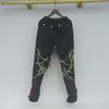 Jeans masculinos primavera 2023 nicho retalhos cordas bandagem calças de cintura alta casual fino cordão calças compridas streetwear
