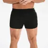 Shorts maschile uomini fitness sport allungati pantaloni corti rapidi bodybuilding che correvano a pallacanestro