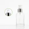 Bouteille en verre transparent vide épaule ronde col argenté brillant pompe à lotion blanche avec bouchon couvercle transparent contenant cosmétique rechargeable portable 40 ml 100 ml 120 ml