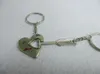 Chaveiros de alta qualidade de moda de metal flechas de ornamento através de um casal de casal de um cupido cardíaco anel B010KeyChains Forb22