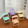 Draagbare houders Mini mobiele telefoonstandaard Desktopstoel 4 kleuren verstelbare Macaron-kleurenstandaard Opvouwbare krimpdecoratie