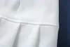 Kobiety super plisowana mini spódnica w kolorze białym / czarnym 220401