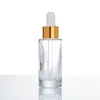 Bottiglie di vetro smerigliato marrone ambrato a spalla piatta da 30 ml da 1 oz con pipetta contagocce per siero per la cura della pelle con profumo di olio