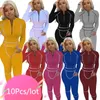 Kvinnors tvåbitar byxor Bulkartiklar Partihandel Set Set Long Sleeve Front Zipper Tops Jogger Matching Set Women Fall Sportswear Suit