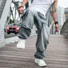 Pantaloni Fashion Tide Hip Hop Jeans a gamba larga oversize Pantaloni larghi in denim da skate larghi Pantaloni multitasche blu chiaro da uomo