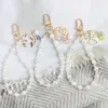 Cadeia de pérolas fofas Antigo Keychain Chay anel para mulheres acessórios de jóias de jóias Caso de pendente de telefone pendente de teclado