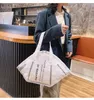 Kvällspåsar maskpåse kvinnlig 2022 stor kapacitet axel rolig handväska shopping duk handväskor kvinnor designer casual tote packevening