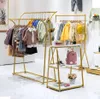 Kinderkledingwinkel display plank commerciële meubels vloer type gouden plankjes babykleding hanger kleding winkelraden rekken voor kinderen stoffen rek