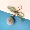 Keychains Creative Keychain Leuke kwastje boog haar kogel auto sleutel ketting fruit kleurtas hanger pluche kleine geschenkaccessoires