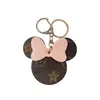 Brown Flower Keychains Rings Cartoon Pu Leather Bow Mouse Gold Car Keyring Holder Cute Bag Pendant Charms Fashion Design smycken gåvor Key Chains Accessories