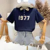 T-shirt da donna Abbigliamento da donna 2022 Summer College Style Stampato Top a maniche corte Sorella Moda Due stiliDonna
