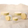 Bouteilles de crème en verre givré Pots cosmétiques ronds Bouteille de crème pour le visage avec bouchon en grain de bois 5g 10g 15g 30g 50g 100g Bouteilles d'emballage