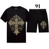 Herrespår Summer Rhinestone Tracksuit Men Women Two Piece Set Casual Tops Kortärmade T-skjortor och shorts Blackmen's