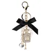 2022 Imitation Pearl Perfume Bottle Keychain Car Key Ring Holder Bag Charm Pendant Accessories Bow Key Chain Fashion Keyring AA220318