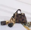 Chaveiro de couro de moeda de moeda estampada clássica com borla Mini Bolsas de armazenamento portátil Sacos de designer de moda Pingente de designer de moda