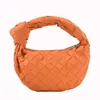 Bag female 2022 new knotted woven clouds women's handheld saddlebag fashion trend youth mobile phone bag 071403