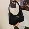 Sac à main nouveau triangle hobo aisselle sac trois en un tissu en nylon imperméable vintge bâton main liquidation