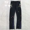 Grote maten herenbroeken 22ss Herfst Winter Europa Splash Ink Patchwork Broek Gouden printbroek Bell-bottoms Casual joggingbroek met trekkoord Z230731