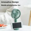 Sommar ny handh￥llen mini elektriska fans som laddar USB b￤rbar tecknad skrivbord mobiltelefon stativ fl￤kt grossist