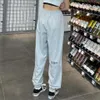 Calça feminina masculina jogador de bolso solto de bolso de hip hop de calça esportiva ao ar livre calças casuais