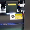 Plotter automatico per il taglio dei contorni delle stampanti con fotocamera