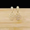 Boucles d'oreilles pendantes en or 18 carats de Dubaï Boucles d'oreilles à pompon en or rose pour une fête de mariage élégante et belle ladys2991794