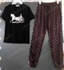 Pantaloni da donna a due pezzi Tunica da ragazza stampata T-shirt a maniche corte e pantaloni con logo colorato Set da 2 pezzi Tute firmate di lusso Abbigliamento donna 0912