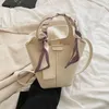 Bolsos de noche Bolsos de cinta de color sólido Pequeño cubo de cuero Bolso bandolera para mujer Bolso de hombro y monederos de moda