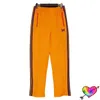 оранжевые женские брюки