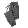 Spodnie fitness Mężczyźni bawełniane nowe spodnie dresowe piepty streetwearowe Modne spodni sznurka na pełną długość dla mężczyzn Casual Spods 4xl G220713