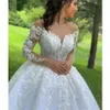 Abiti da sposa in pizzo scintillante Abito da ballo principessa 2022 Fiori di perline Corpetto trasparente Maniche lunghe Lunghezza pavimento Abiti da sposa C0316224e