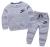 Niños 100% de jogging traje de jogging de algodón Conjuntos de logotipo de los niños Running al aire libre Sports Teenage Clothing Sweatershirt + pantalones