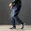 Jeans masculinos Moda de streetwears soltos Fit Spliced ​​Designer Cargo Pants Harem Slack Bottom Hip Hop Ripped Joggersmen's