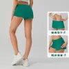 07 Summer Breattable Snabbtorkning Sports Hotty Hot Shorts Women's Solid Color Pocket Running Fitness Pants Princess Sportswear Gym Leggings1061311