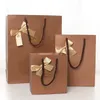 13157cm Noble Color Bowknot Paper Gift Bag Business Gift Favors Wrapping Bag Festive Gift Package Party Supplies 20pcslot WS0842788105