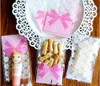 400pcs / parti 7 * 10cm (2,8 * 3,9 ") Rosa Lace Bowknot Cookies Förpackningsväska Självhäftande Plastpaketpåse Påsar För Biscuitkakor Bakning