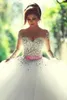 Sheer Tulle Ball Gown Wedding Dresses 2020 with Illusion Long Sleeves Crew Neck Lace Up Back Sequins Beaded Pearl Pretty Bridal Gowns BO7695