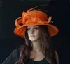 Big Orange Large brim Sinamay Hat with ostrich feather spine for wedding races