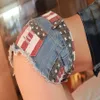 Partihandel-sommar låg midja print denim booty shorts för kvinnor vintage amerikanska flagga mönster hål tofs sexiga mini jeans club heta byxor