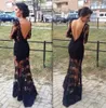 Sexy See Through Evening Prom Dresses 2015 Lange Mouwen Zwart Kant Avond Feestjurken Geschulpte hals Backless Mermaid Arabische Jurken