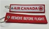 Air Canada Remove Before Flight Porte-clés brodé avec logo brodé personnalisé, accepte n'importe quelle couleur et taille 13 x 2,8 cm, lot de 100 pièces