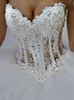 2018 Cheap Bling Ball Gown Puffy Wedding Dresses Sweetheart Lace Appliques Beaded Pearls Tulle Illusion Long Sweep Train Formal Bridal Gowns