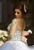 Prestiżowe kryształy suknie ślubne z długim rękawami gorset suknie ślubne z sheer załogi zroszony z koralikami Soft Tulle Arabski Plus Size Soads