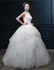 2024 Bröllopsklänningar Nya heta mode gratis frakt elegant bollklänning elfenben golvlängd applikationer pärlor halter tyll brud klänningar