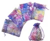 100pcs Modèles corallins cordon de cordon Sacs d'organza Sacs de bijoux de bonbons pour la fête de mariage Favors Sacs-cadeaux de Noël violet 2 Si3338027