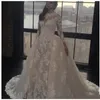 Afrikanisches Hochzeitskleid mit langen Ärmeln und abnehmbarem Rock, transparenter Ausschnitt, Spitzenapplikationen, Hochzeitskleid, maßgeschneidertes Dubai-Brautkleid