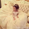 Gorgeous Off Shoulder Lace Applique Flower Girl Dresses For Wedding Sheer Long Sleeve Lace Up Back Girls Pageant Gowns Sweep Train