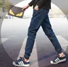Groothandel 2016 Denim Jeans mannen Cuffed Pen Broek Tieners Elastische Taille Trekkoord Negende Broek Jongens Hip Hop Harembroek 27-34